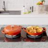 The enamel cast iron/Dutch oven soup pot features a circular shower-style lid design